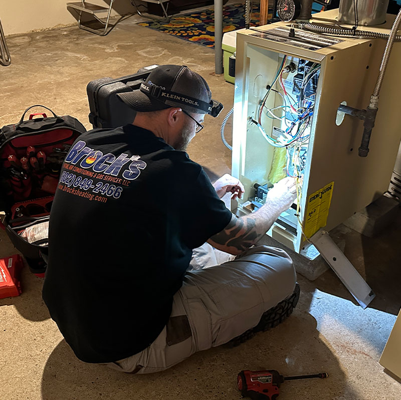 Andrew performing an annual inspection on a furnace