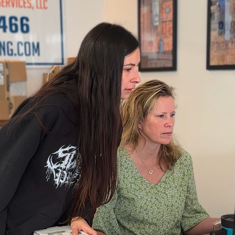 Tawyna & Elayne looking at the schedule on a computer