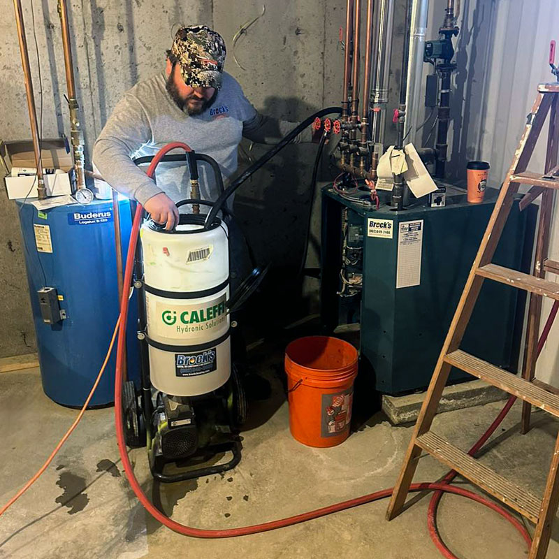 Sean Brock working on a furnace