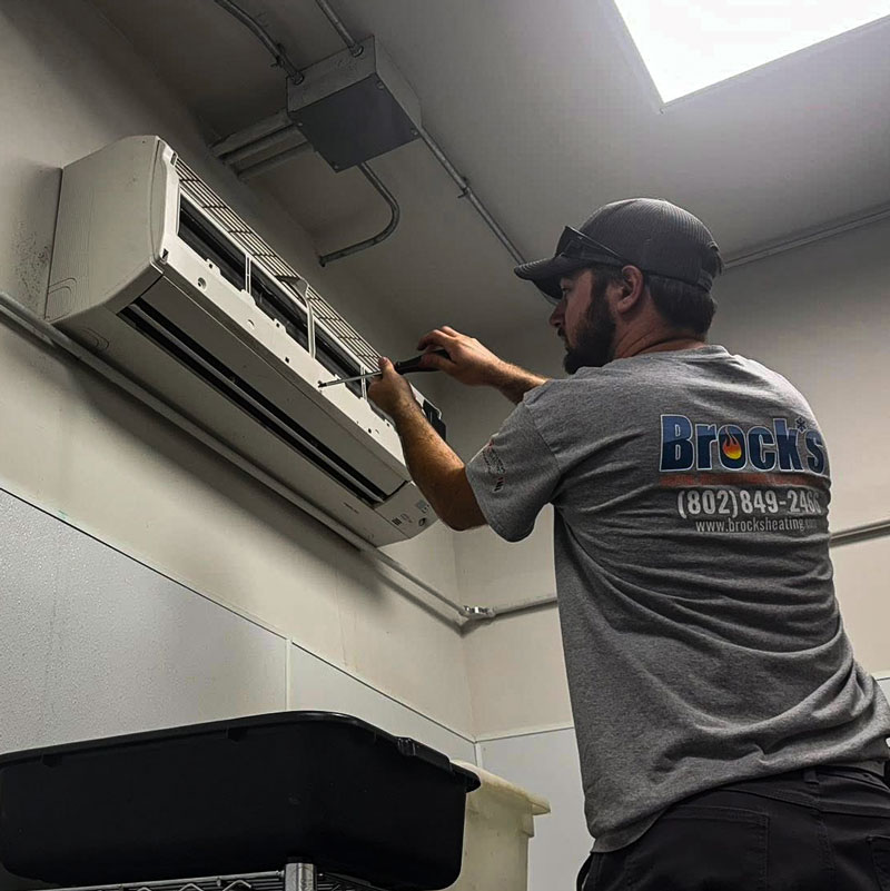 Brock tech removing plate on heat pump in order to clean it