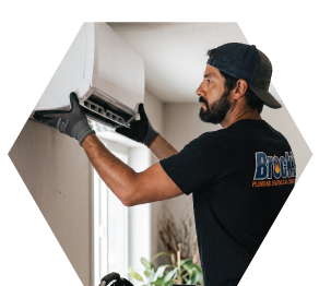 Tech installing a heat pump